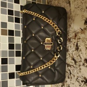 Black handbag with gold chain handle